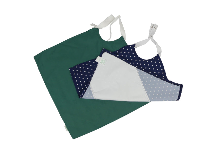 Woman wearing a navy spotted Catchkin clothing protector