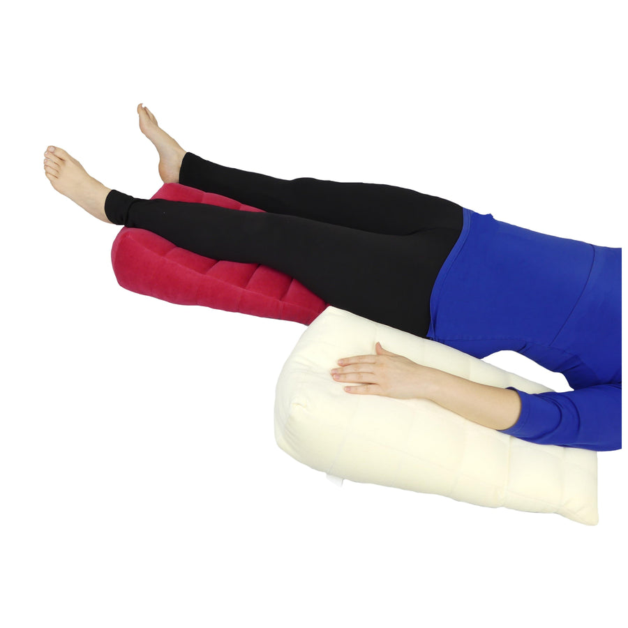 Leg and arm ramp cushions shown supporting a person lying down